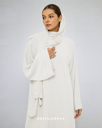 Sandra Abaya in Off White